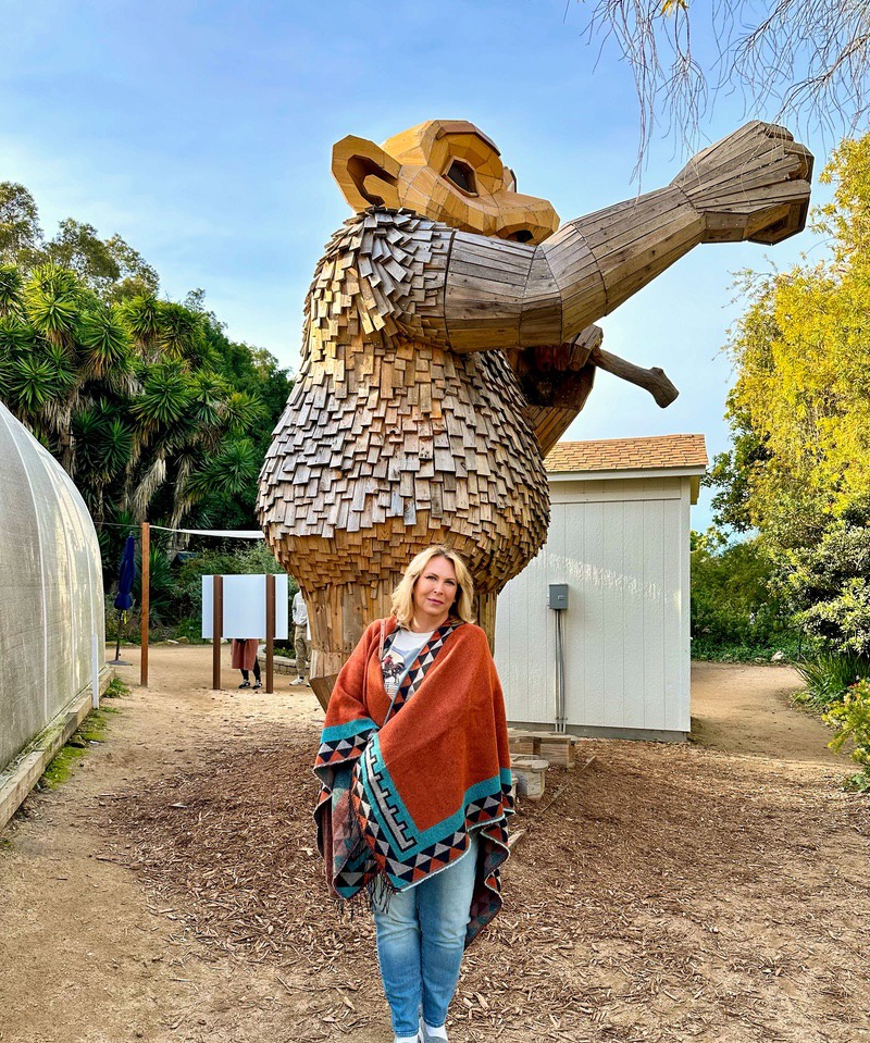 The giant wooden trolls compared to me