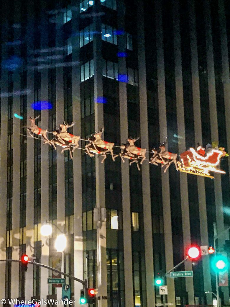 Santa flying above Beverly and Wilshire